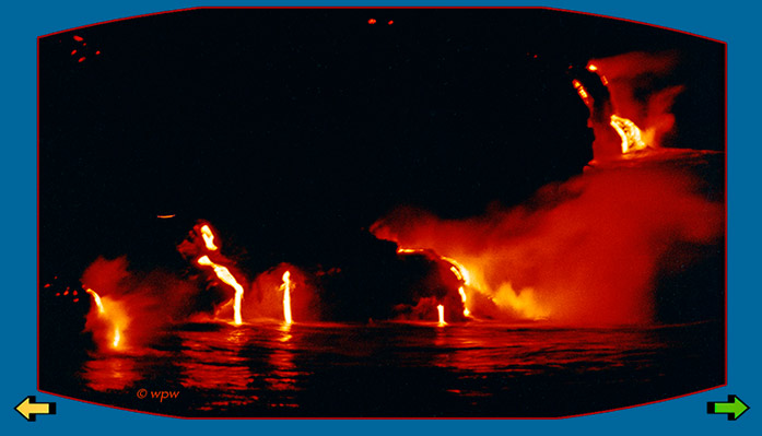 <Photo of vivid red lava flow from Kilauea Volcano into Pacific Ocean at night>